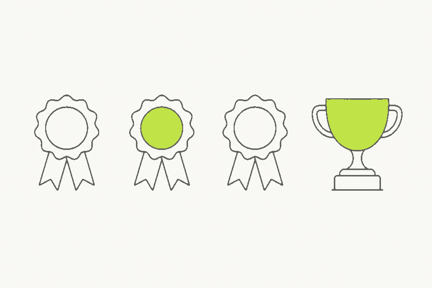 Line drawing of three award rosettes and a trophy cup in a row